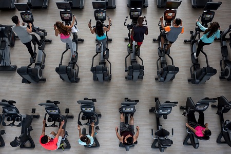 People using cardio equipment