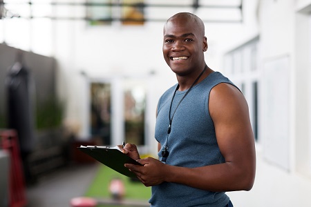 Personal trainer working with client